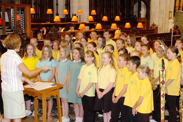 Miss Beckett conducts Burlington Junior School choir at Priory Church to start the Old Town Festival in 2006. Do you recognise any of the people in the picture? Photo taken by Paul Atkinson (PA0628-27)