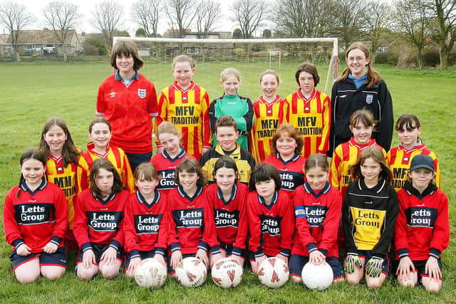 Two girls football teams (Under 10s and Under 11s) show off their new sponsored kits at Flamborough in 2004. (PA0415-35)