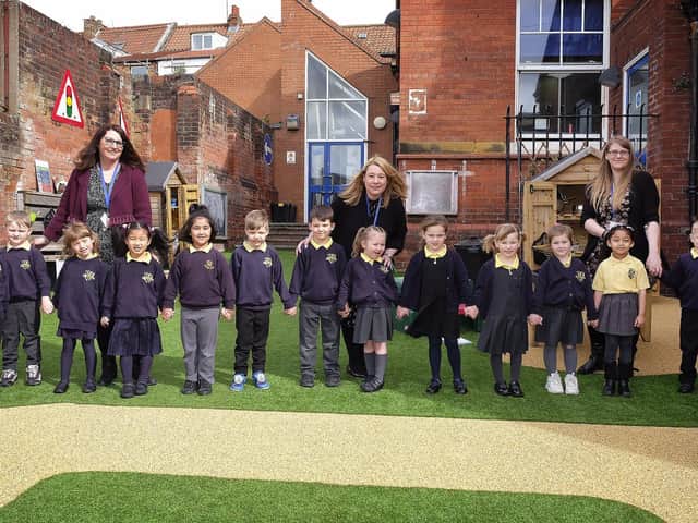 Teachers Penny Carver and Caroline O'Keeffe with pupils.