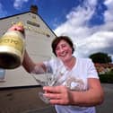 Belinda Leppington at the Crown Tavern, pictured celebrating when pubs were allowed to reopen after lockdown in June 2020.