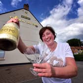 Belinda Leppington at the Crown Tavern, pictured celebrating when pubs were allowed to reopen after lockdown in June 2020.