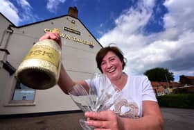 Belinda Leppington at the Crown Tavern, pictured celebrating when pubs were allowed to reopen after lockdown in June 2020.