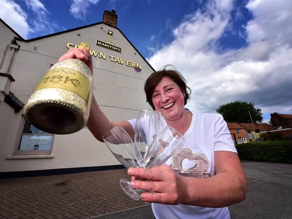 Belinda Leppington at the Crown Tavern, pictured celebrating when pubs were allowed to reopen after lockdown in June 2020.