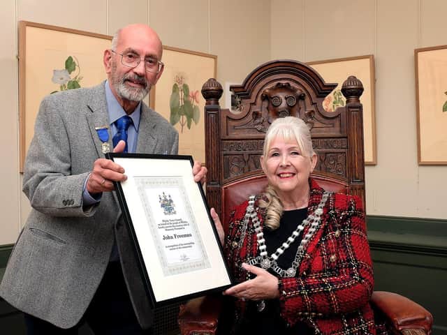 John Freeman receives his Honorary Freeman award from the Mayor of Whitby, Cllr Linda Wild.