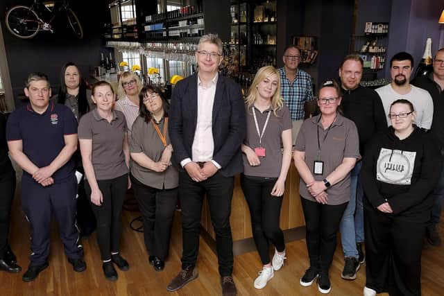 General Manager Jay Clements (centre) with the team at the Bike and Boot Hotel.