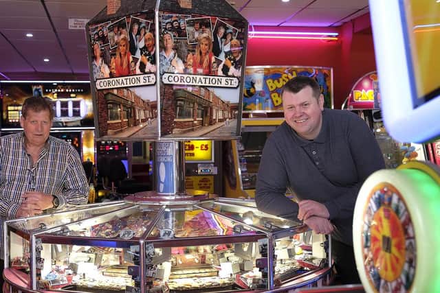 Staff Derek Burley and Jason Webster at Silver Dollar amusement arcade.