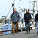 Fishermen, from left, Andrew Sanderson, Frank Powell and Shaun Wingham, are pictured at Bridlington harbour.