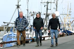 Fishermen, from left, Andrew Sanderson, Frank Powell and Shaun Wingham, are pictured at Bridlington harbour.