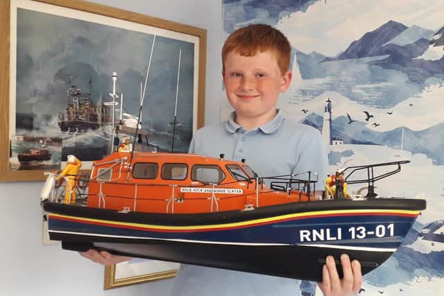 Bridlington Model Boat Society member Rowan Fothergill is pictured with the 1/16th Shannon Lifeboat.