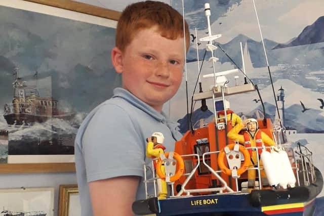 Bridlington Model Boat Society member Rowan Fothergill is pictured with the 1/16th Shannon Lifeboat.Bridlington Model Boat Society member Rowan Fothergill is pictured with the 1/16th Shannon Lifeboat.