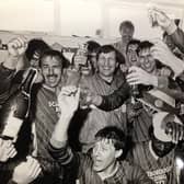 Scarborough FC legend Mitch Cook, pictured centre, celebrating Boro's promotion to the Football League.