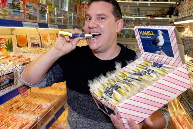 The Harbourside Gift Shop..Miles Jackson samples his special seagull-flavoured rock.