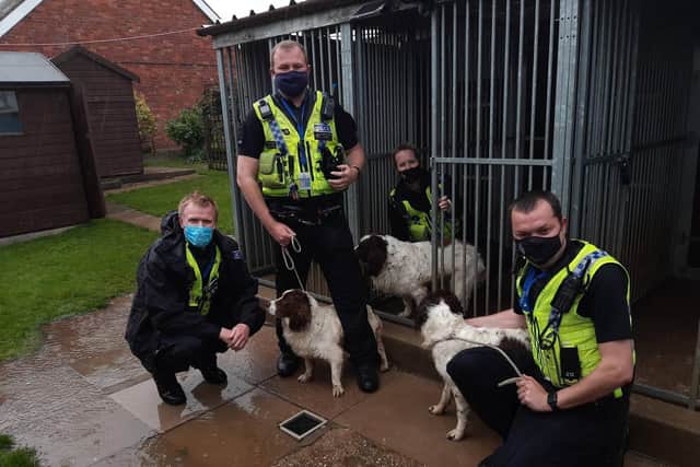 Members of Humberside Police's Rural Task Force with the three dogs.