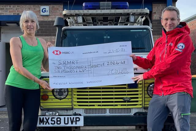Caption: Run4Rob organiser Julia Webb hands over the total to Scarborough and Ryedale Mountain Rescue Team Chairman Jon Bateman, who was also the team member attending along with Yorkshire Ambulance Service when Rob died. Picture: Julia Webb