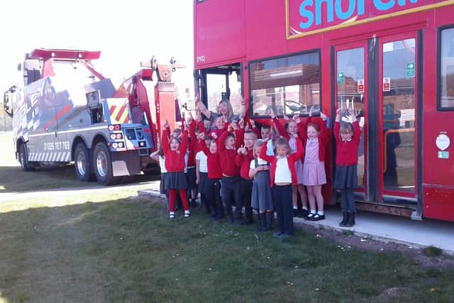 Children celebrate the bus arriving at school. Picture: EBOR Academy Trust