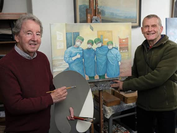 Mr Stuttle and Mr Grice with the original painting of the three nurses.
