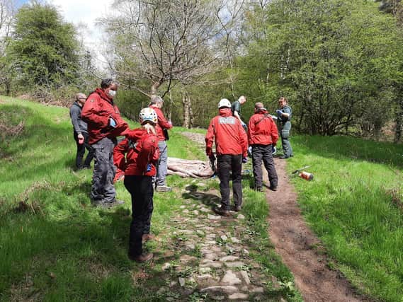 Scarborough and Ryedale Mountain Rescue Team helped paramedics move the patient.