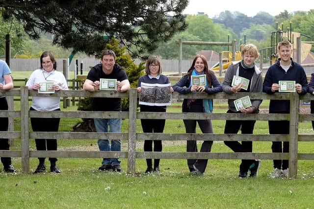 Staff members Darren Squire, Jodie Wood and Tom Venner with the pupils who created the nature trail.