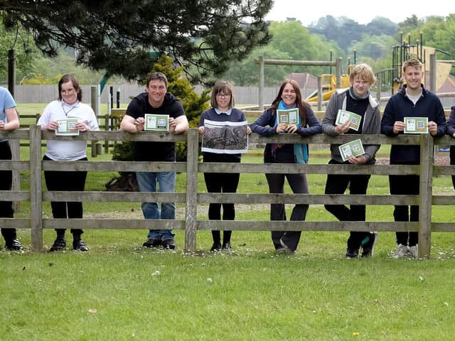 Staff members Darren Squire, Jodie Wood and Tom Venner with the pupils who created the nature trail.