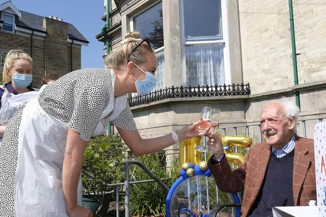 Kim Thomson and George toast a glass to the special occasion.