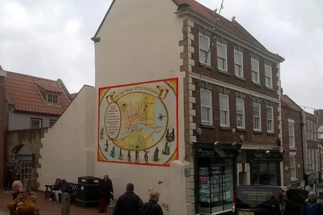 An artist's impression of how the mural would look on the wall of Astin's estate agents in Whitby.