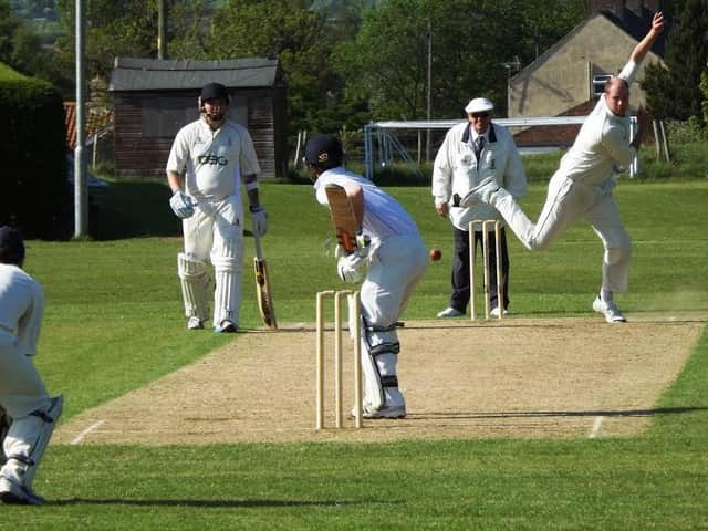 Tom Bumby, above in bowling action, hit 27 in Heslerton's win