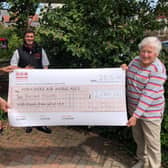 YAA representative Keiron Hardwick is presented with the cheque for £2,000 by Helen Clifton and Barbara Ratcliffe.