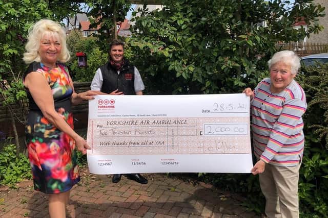 YAA representative Keiron Hardwick is presented with the cheque for £2,000 by Helen Clifton and Barbara Ratcliffe.