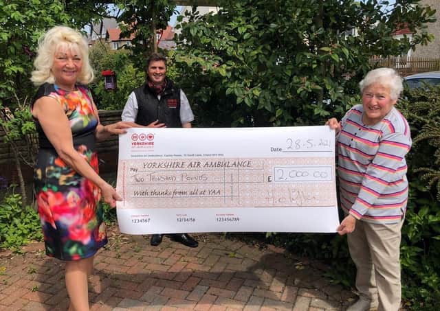 YAA representative Keiron Hardwick is presented with the cheque for £2,000 by Helen Clifton and Barbara Ratcliffe.
