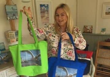 Hannah Huxford shows off some of the merchandise based on the outstanding seagull photo which was taken at Bridlington.