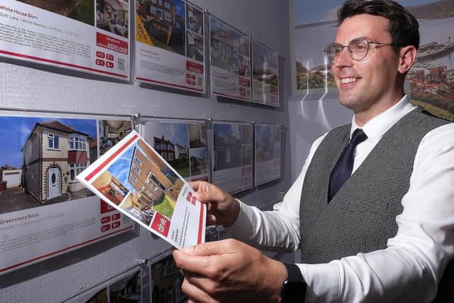 James Duncan viewing the housing information at Colin Ellis. Picture: JPI Media/ Richard Ponter