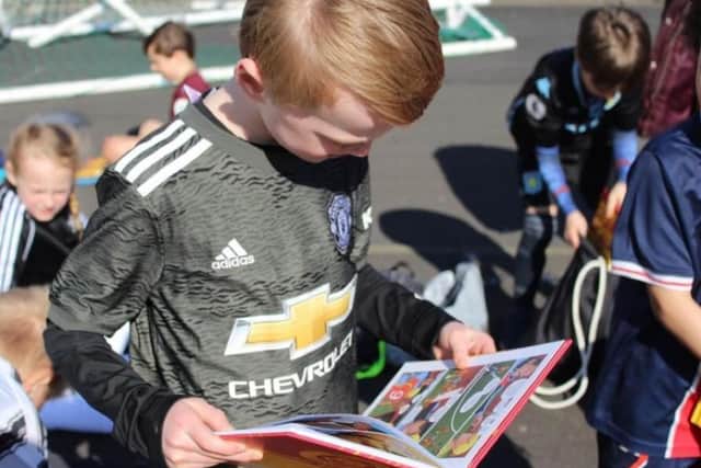 Robbie Hawkes has gifted over 500 Roy of the Rovers books to those attending his football sessions