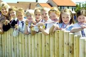 St Martin’s School winning athletics team with their trophy and medals.