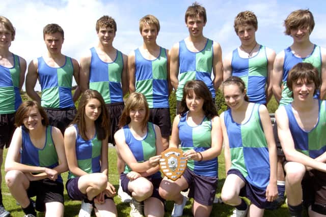 Whitby Community College athletics team with their trophy.