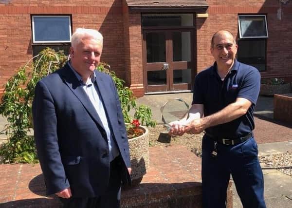 Bill Adams, TUC Regional Secretary for Yorkshire and the Humber region, presents Franco Villani (right) with his health and safety award.