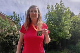 Sarah Monteith shows off her gold medal.