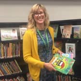 Laura Hellfeld of Kokopie Families wearing one of the lanyards in a county library