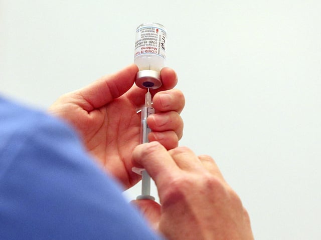 A vial of the Moderna Covid-19 vaccine. Photo by Steve Parsons / POOL / AFP via Getty Images