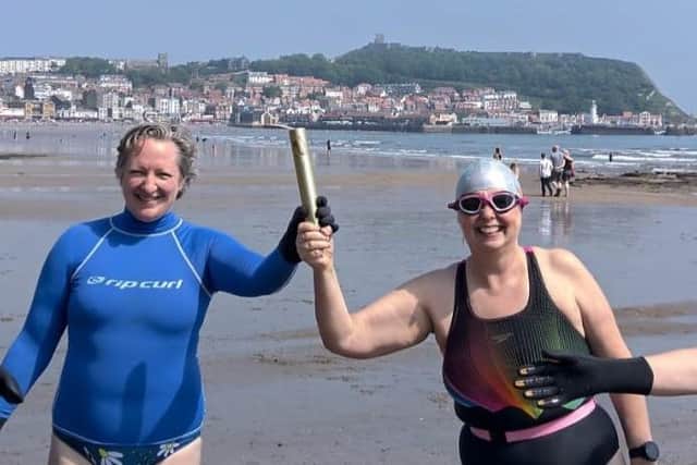 Rally supporter Katie Braida and WRT Scarborough lead Caroline Powell with the campaign baton in South Bay.