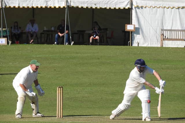 Wykeham 2nds batsman Sam Colling on the way to 71no in Saturday’s CPH Beckett League Division Two match, with fans looking on from the marquee