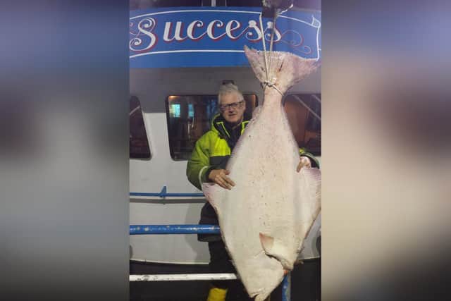 Whitby fisherman Andrew Leadley with the huge halibut.