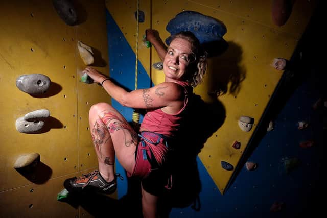 Melanie Bonney in action on the wall.