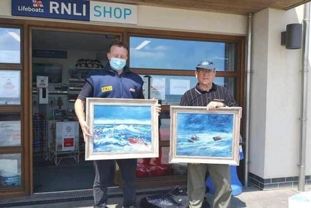 Two lifeboat paintings by West Yorkshire Artist Malcolm East are on display at the King Street RNLI shop.