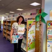 Outreach Librarian Adele Duffield at Whitby Library, with the Summer Reading Challenge certificates.