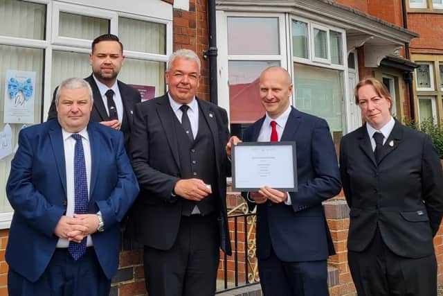 Funeral Manager Max Robinson receives his long service award.