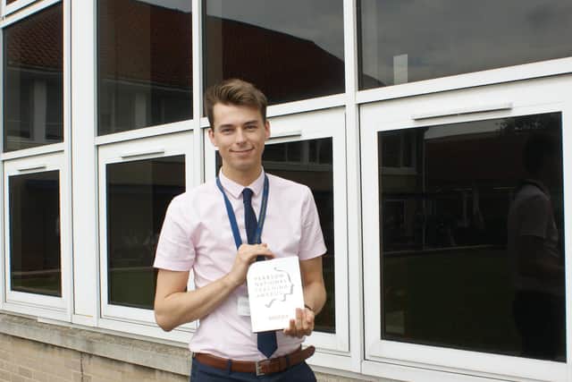 Sam Craggs with his silver Pearson National Teaching Award.