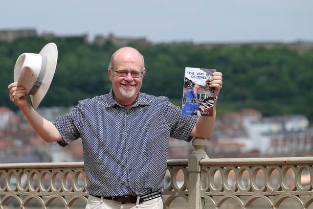 Howard Beaumont with his new book