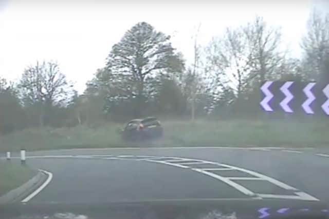 A still from the video showing the stolen car exiting the road onto the grass verge. Picture: North Yorkshire Police
