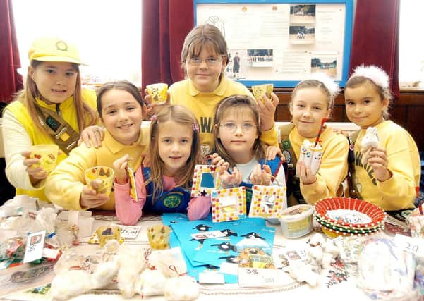 This excellent picture shows the Brownie and Rainbow Stall during St John Burlington Methodist Church’s Christmas Fayre in the School Room. Photograph taken by Paul Atkinson. (PA0347-27b)