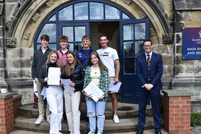 Students celebrate on the school steps with headmaster Guy Emmett, right. Picture: Scarborough College.